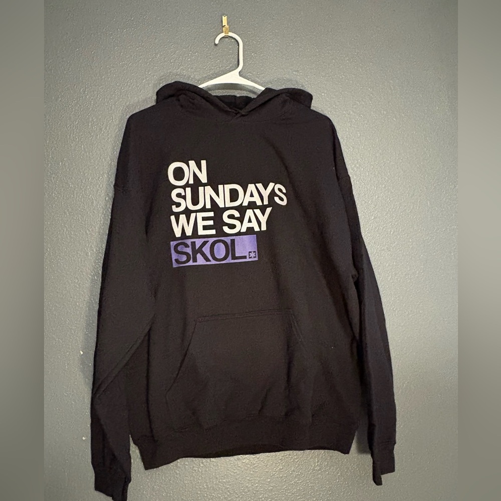 Black Hoodie with Minnesota Vikings slogan on it